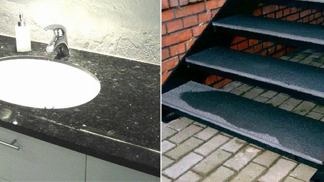 Sort granitvask med vandhane til venstre og grå trappe med skridsikre trin til højre.